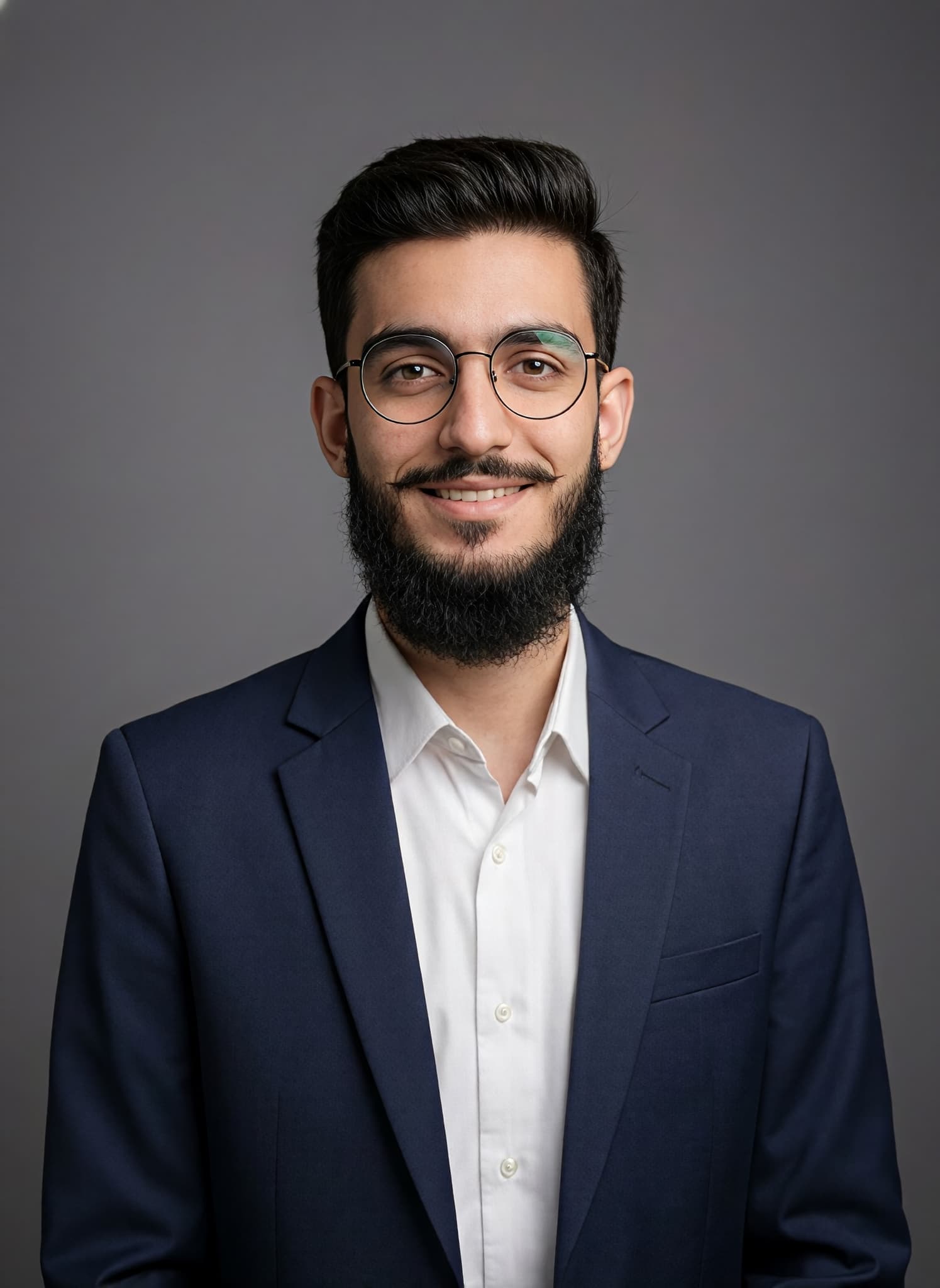Musa Khan wearing a navy suit